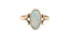 A 9 carat gold dress ring that features an oval shaped opal. Measures 12x6.7mm, with a&nbsp; very good play of colour across the white background. 