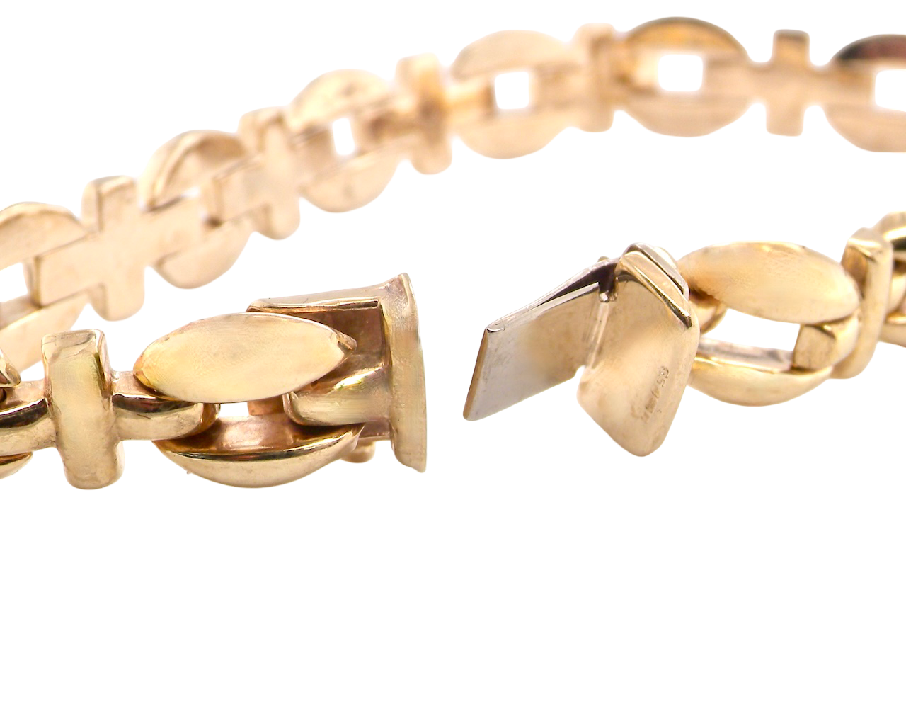 Close-up of a gold chain bracelet on a white background