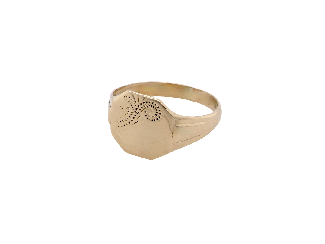 A gold signet ring with a flat, engraved face and a beveled hexagonal shank, shown on a plain white background.