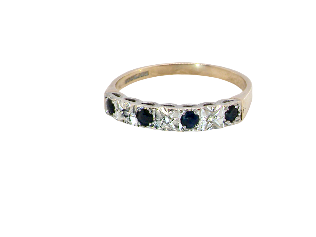A 9 carat gold half hoop eternity ring. Set with four sapphires, each 2.4mm, and between each a 1mm  set diamond.