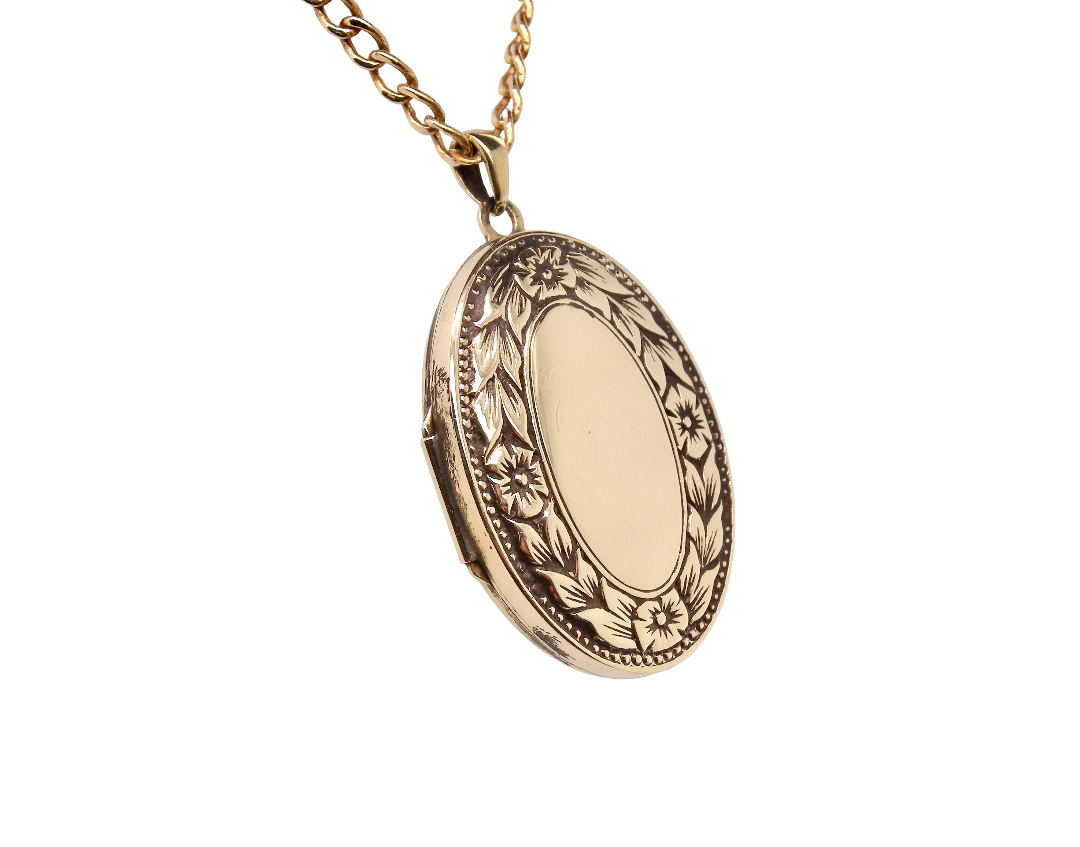 A 9 carat gold locket*, oval shaped, measures 30x20mm, depth 5mm.&nbsp;