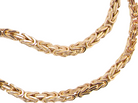 A close-up of a gold-toned braided chain necklace on a plain white background.