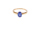 A 9 carat gold ring containing a single oval cut tanzanite gemstone. Measures 8x6mm, four claw setting.