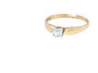 A 9 carat gold solitaire ring. Features a single white diamond 3.4mm (est 0.15 carats)
 side