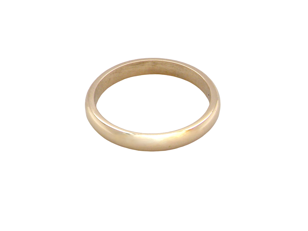 A simple, polished yellow gold band ring photographed on a seamless white background.