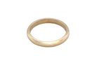 A simple, polished yellow gold band ring photographed on a seamless white background.