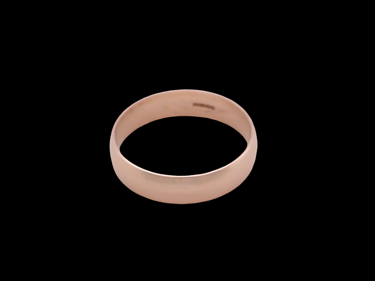 A 9 carat rose gold wedding ring.

Plain D shape 