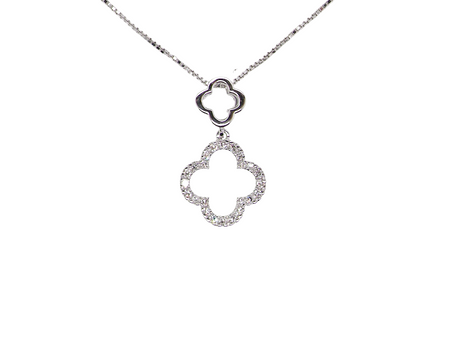 A 9 carat white gold pendant in the 'Alhambra' style. Set with twenty four small white diamonds, carat total 0.12 carats.
