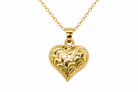 A 9ct gold patterned heart pendant closeup view