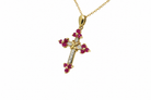 Side view of ruby and diamond cross