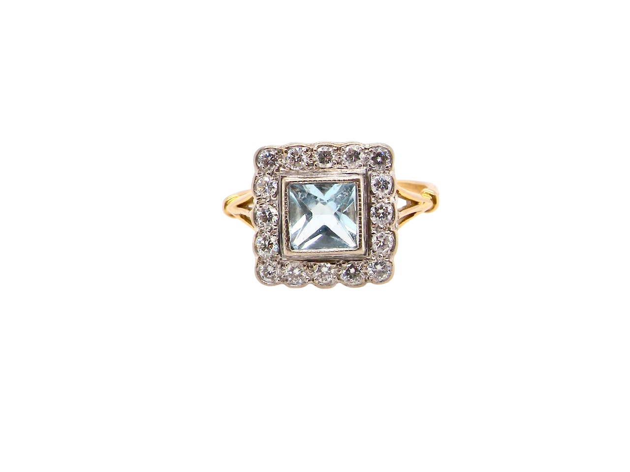 A vintage Aquamarine and Diamond cluster ring