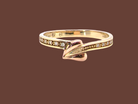 A Clogau ring which has set into the band twelve small white diamonds, 