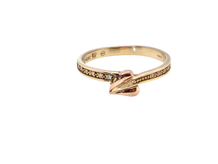 A Clogau ring which has set into the band twelve small white diamonds, each 1.2mm (est total 0.06 carats)
