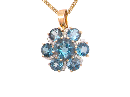 A Diamond and Blue Topaz pendant
