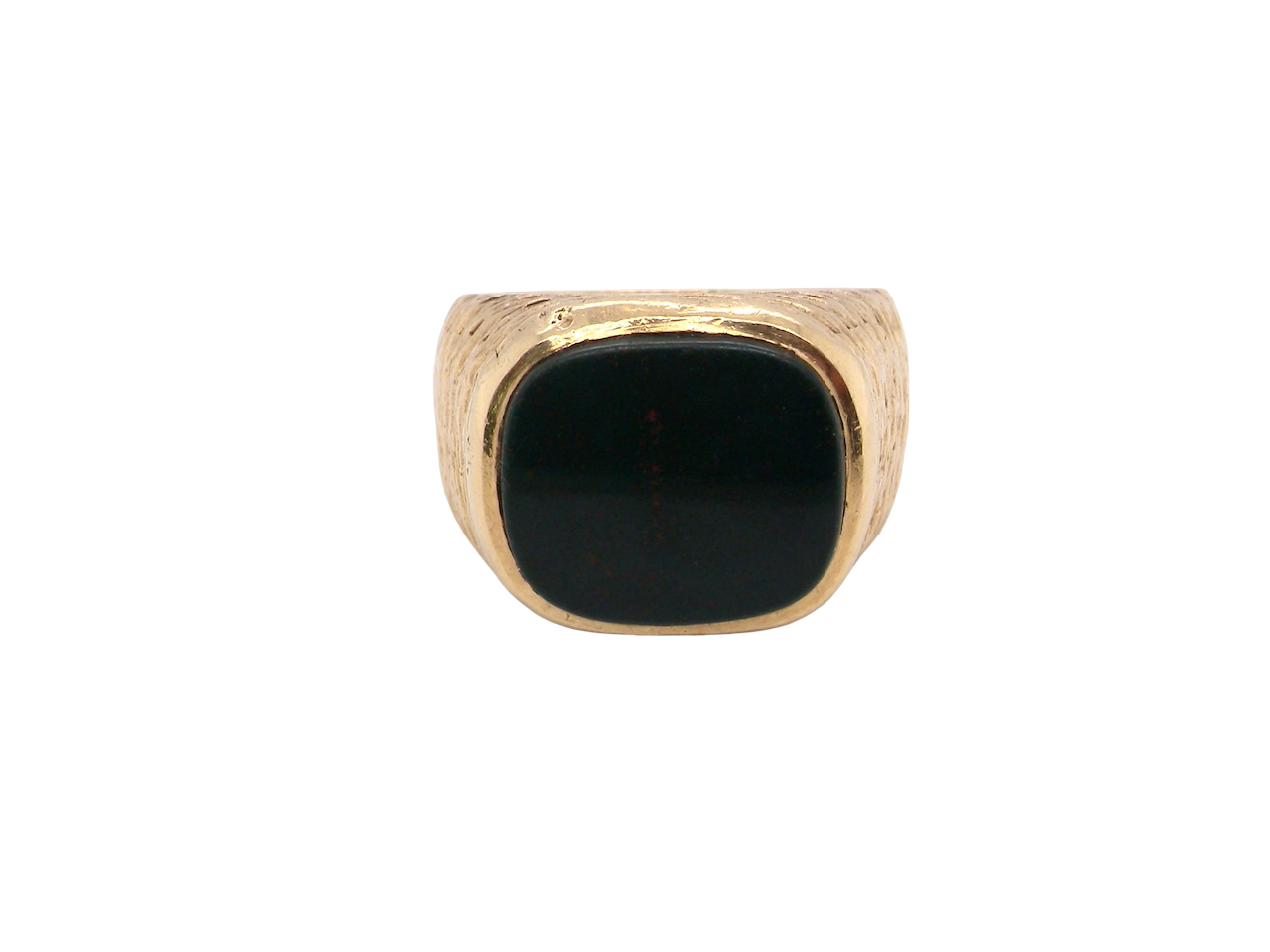Gold ring with a black stone on a white background