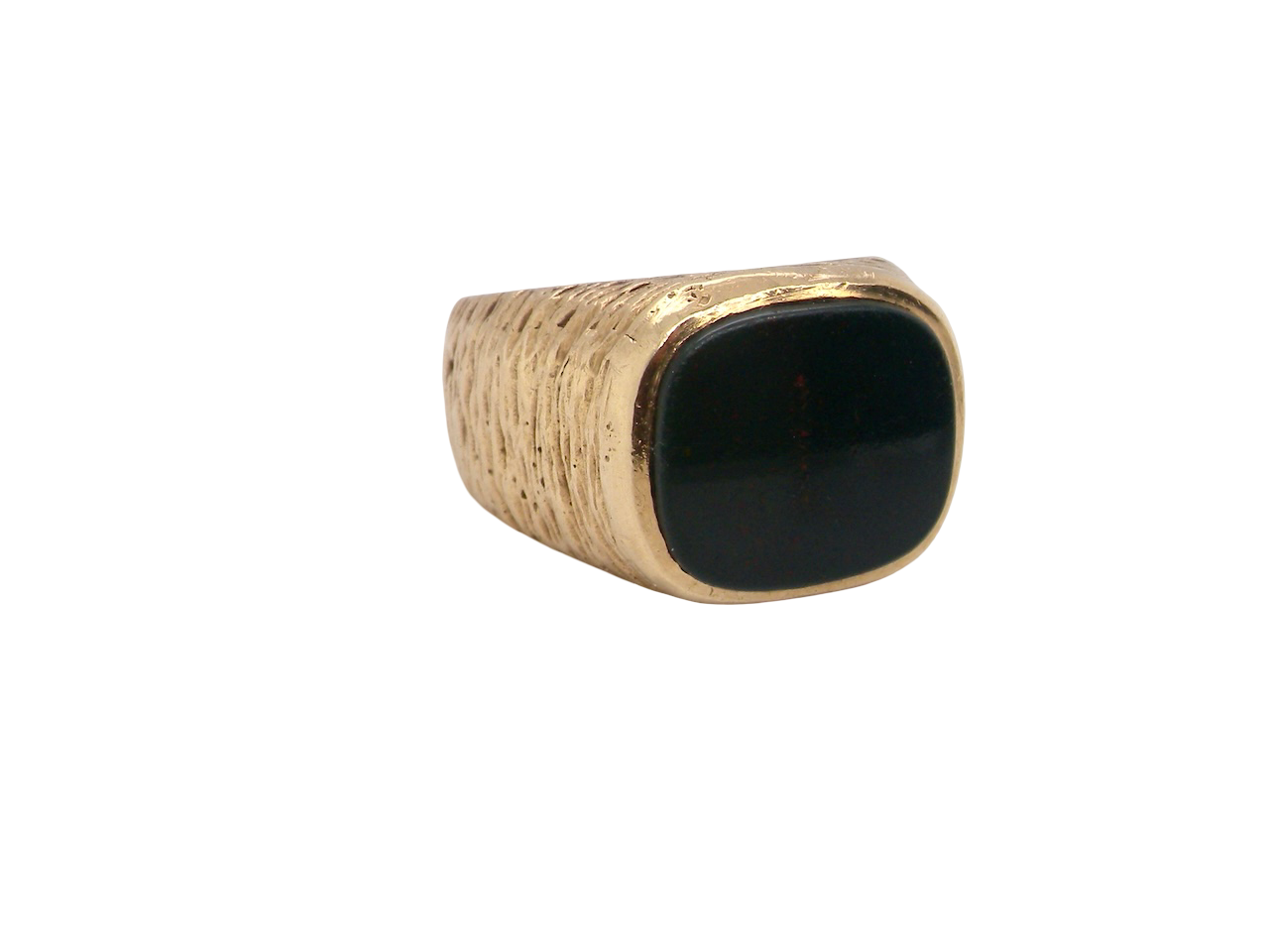 Ring with a black stone and gold band on a white background