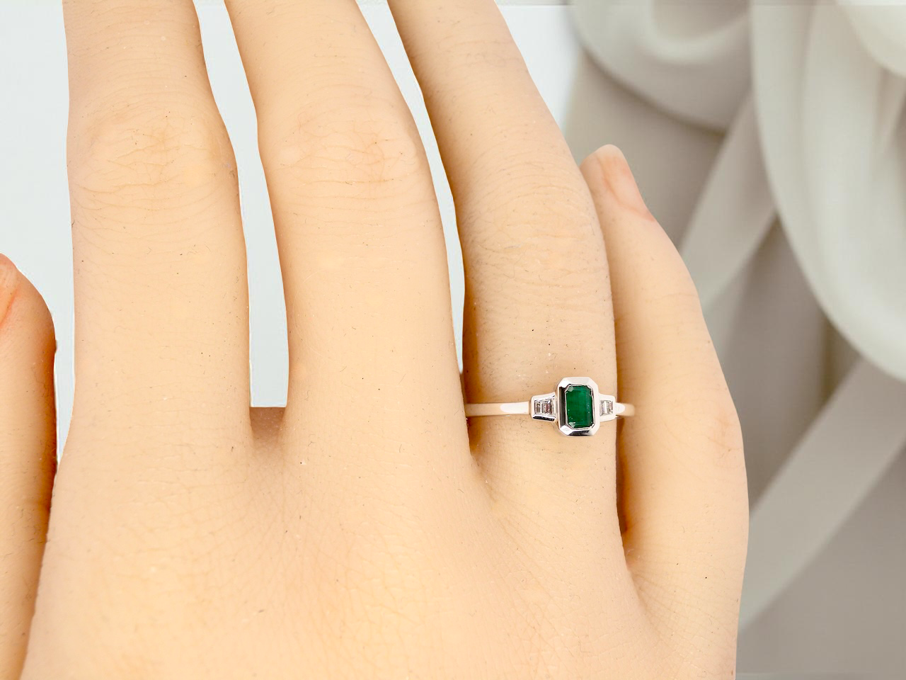 A NEW Emerald and Diamond ring