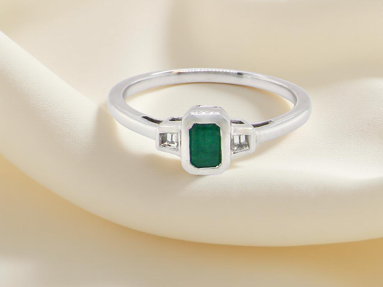 A NEW Emerald and Diamond ring