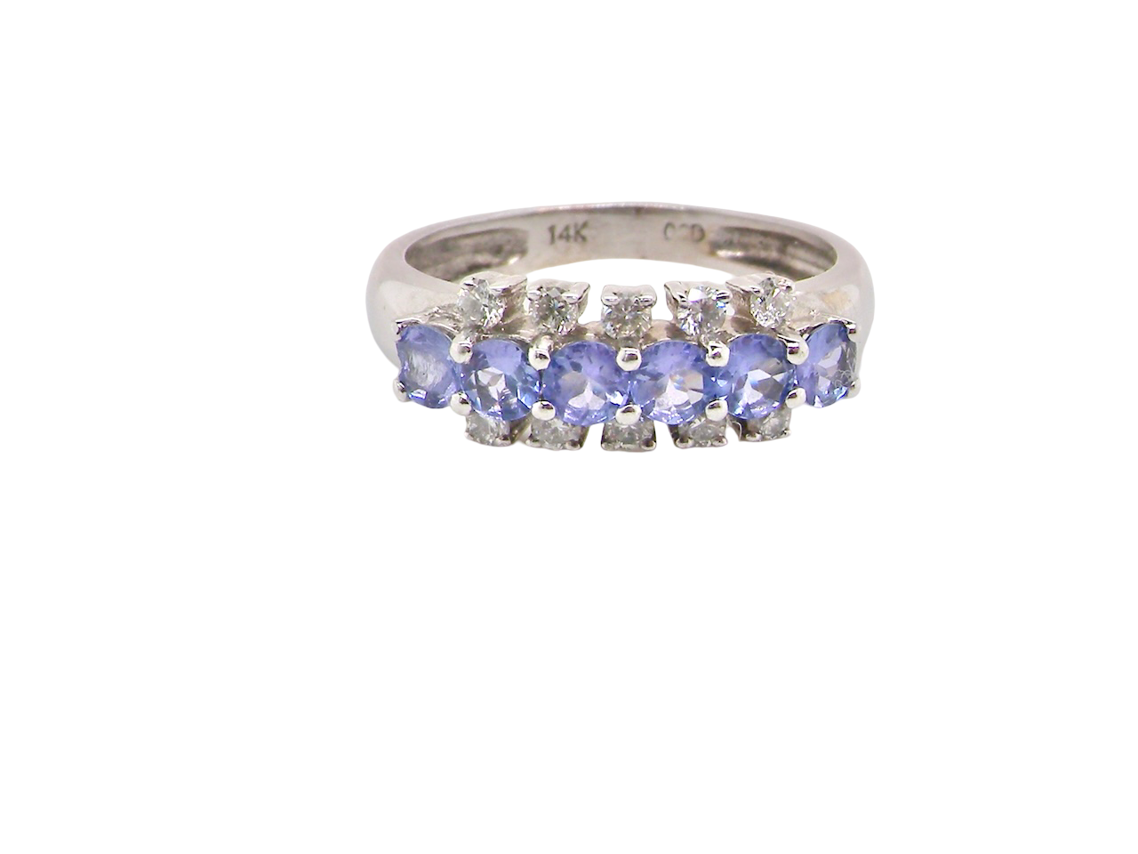 A Tanzanite and Diamond half hoop ring
