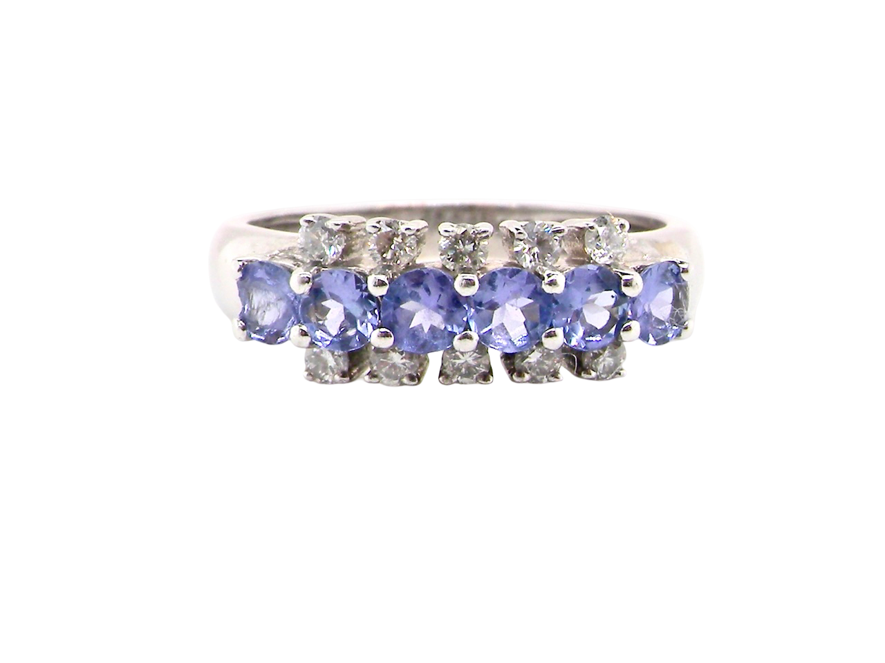 A Tanzanite and Diamond half hoop ring