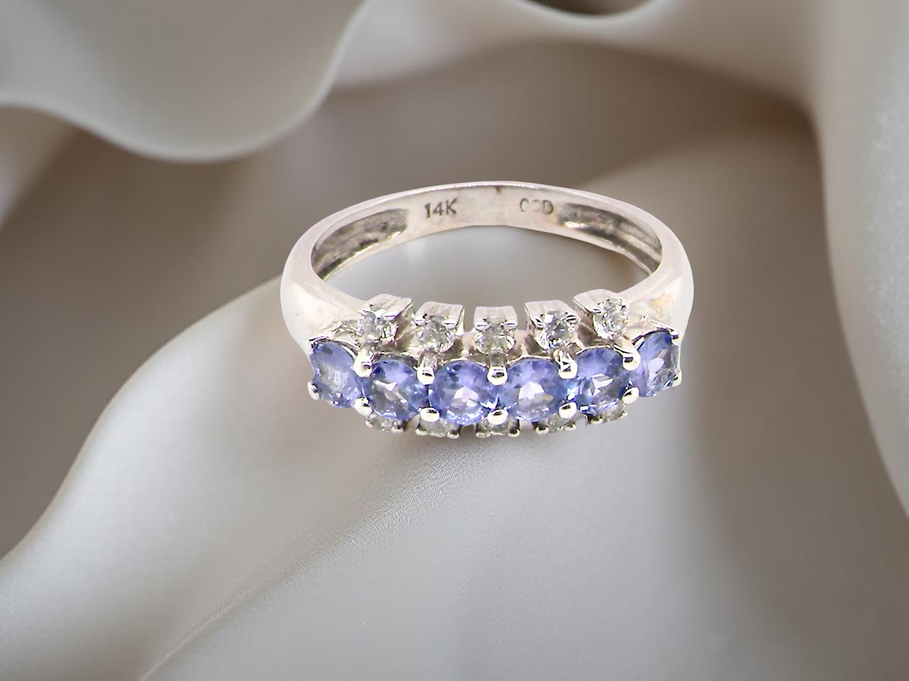 A Tanzanite and Diamond half hoop ring