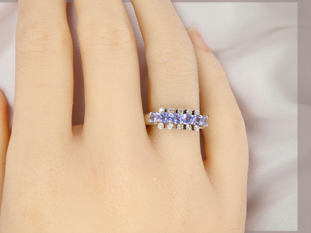 A Tanzanite and Diamond half hoop ring