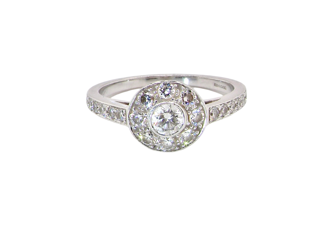 A target cluster diamond ring with a principal diamond surrounded by smaller ones, set in platinum.