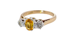 A beautiful 18 carat yellow gold trilogy ring, combining the warm golden tones of a yellow sapphire with&nbsp; white diamonds. side