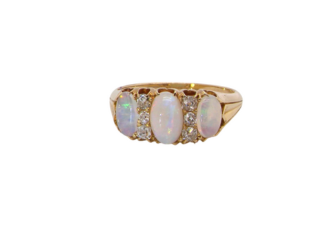 A beautiful Victorian dress ring, set with three finely matched oval opals, 