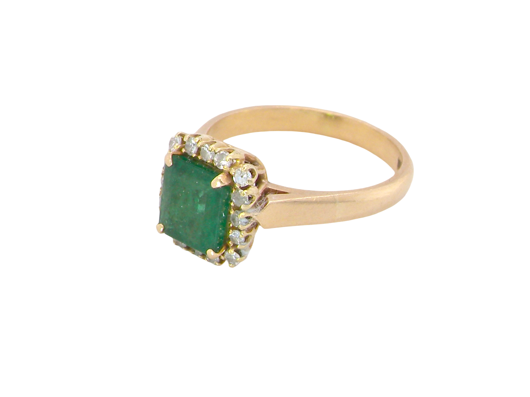 A beautiful cluster ring set with a large square-cut emerald measuring approximately 7 x 7mm, displaying a deep grass-green colour with natural inclusions, as expected in emeralds. side