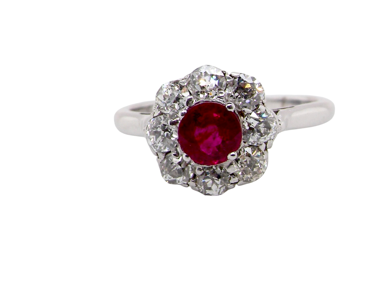 A beautiful cluster ring set with a raspberry-red ruby centre stone 0.50 carats.