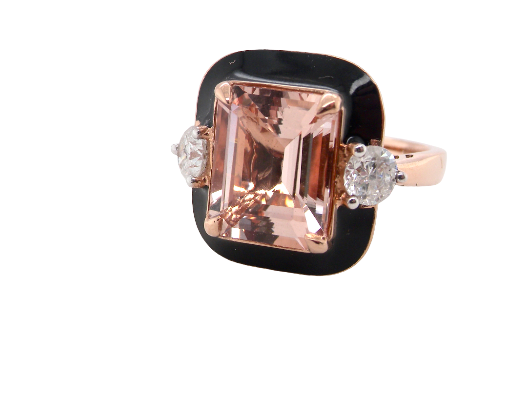A square-cut rose gold ring featuring a large emerald-cut peach morganite center stone, flanked by two round-cut clear diamonds and accented with a black enamel border, set against a plain white background.