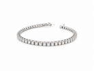 A beautiful tennis bracelet set with approximately sixty brilliant cut white diamonds to a total carat weight  3.50 carats.

