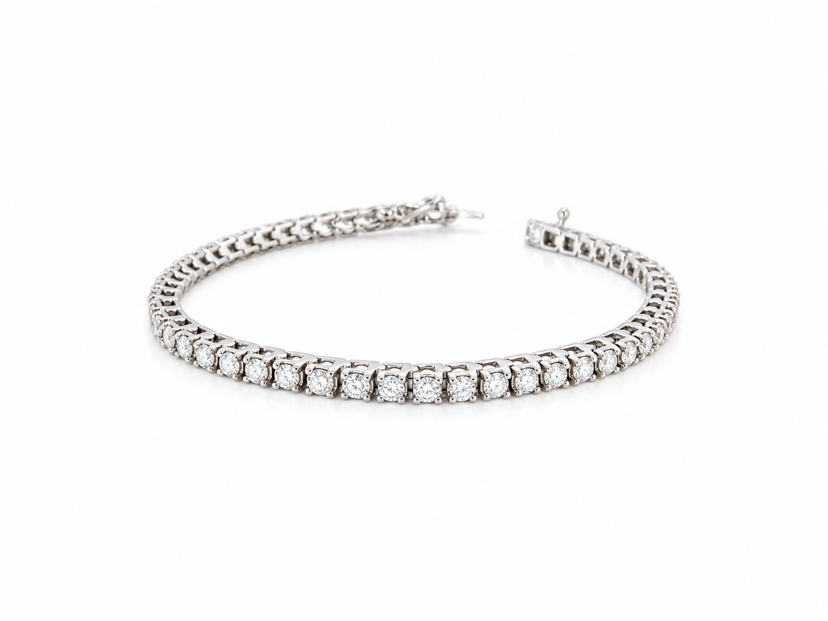 A beautiful tennis bracelet set with approximately sixty brilliant cut white diamonds to a total carat weight  3.50 carats.
