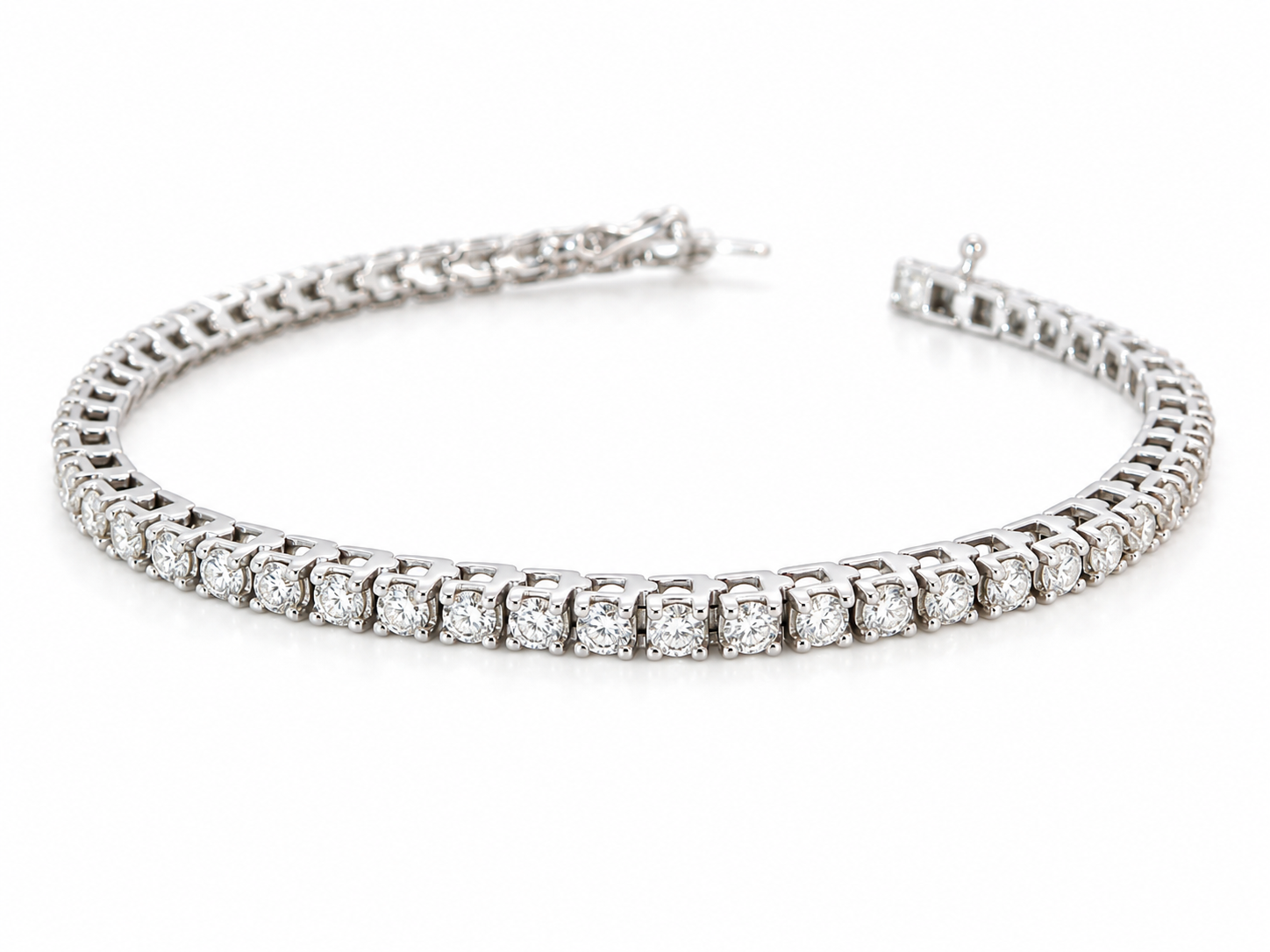 A beautiful tennis bracelet set with approximately sixty brilliant cut white diamonds to a total carat weight estimated at 3.50 carats.
