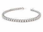 A beautiful tennis bracelet set with approximately sixty brilliant cut white diamonds to a total carat weight estimated at 3.50 carats.
