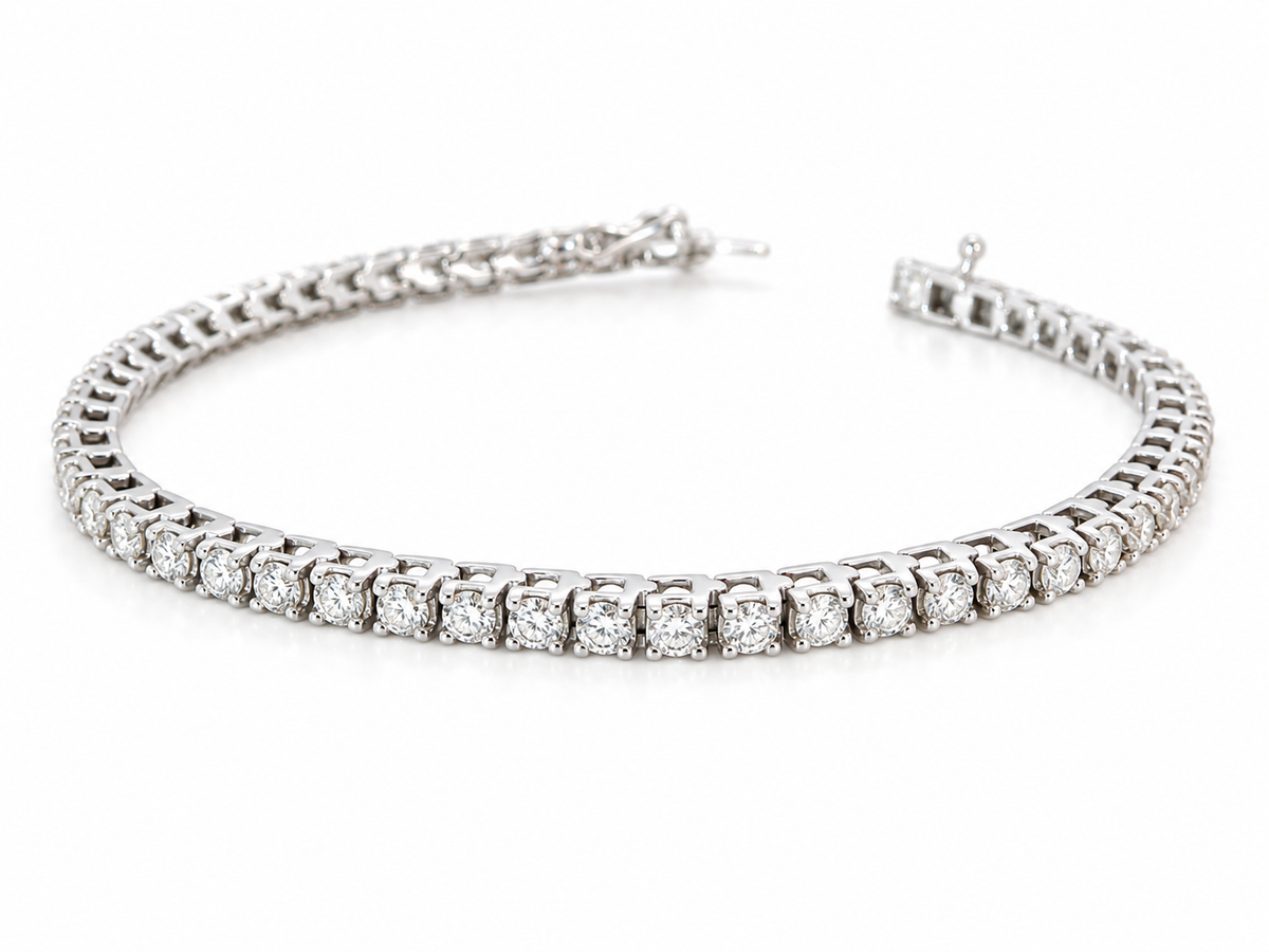 A beautiful tennis bracelet set with approximately sixty brilliant cut white diamonds to a total carat weight estimated at 3.50 carats.
