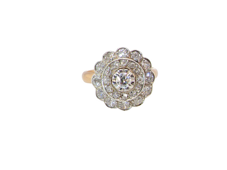 A beautiful vintage diamond cluster ring.&nbsp; Know as a target cluster, the diamonds are old brilliant cut. Centre diamond 3.8mm (0.20 carats) .&nbsp;