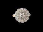 A beautiful vintage diamond cluster ring.&nbsp; Know as a target cluster, the diamonds are old brilliant cut. Centre diamond 3.8mm (0.20 carats) .&nbsp;vintage