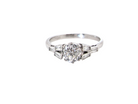 A beautifully proportioned Art Deco solitaire ring showcasing a sparkling old brilliant cut white diamond