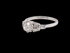 A beautifully proportioned Art Deco solitaire ring showcasing a sparkling old brilliant cut white diamond side