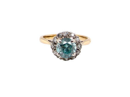 A blue zircon and diamond cluster ring