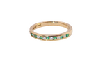 A brand new half hoop eternity ring. Set with eight 1.3mm emeralds (total 0.12 carats) and interspaced with brilliant cut white diamonds, each 1.3mm (0.10 carats)