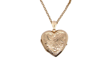 A charming heart-shaped locket, beautifully detailed with delicate scrolled engraving to the front. 