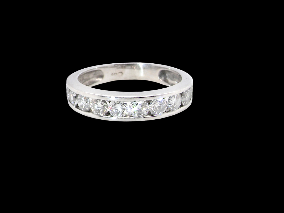A classic 18 carat white gold half hoop diamond eternity ring, beautifully set with ten brilliant cut white diamonds.