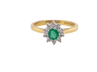 A classic cluster ring. Features to the centre a round emerald, comlimented by an outerv halo of brilliant cut white diamonds