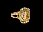A continental dress ring that tests as 18 carat gold. Features a large citrine gemstone, that measures 18x13mm, depth 9mm. Golden with a hint of olive green.&nbsp;