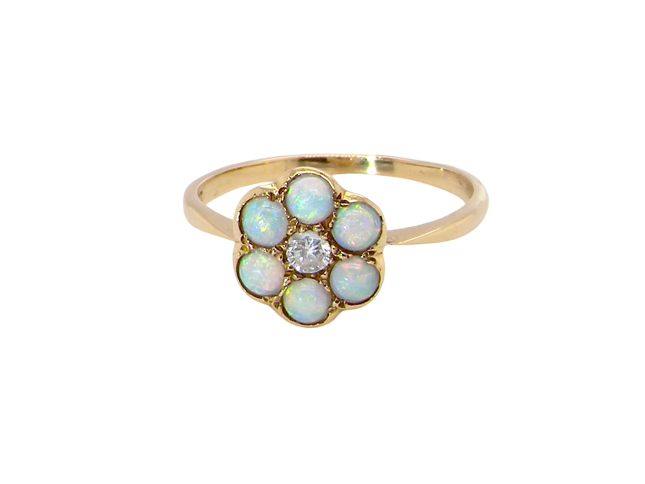 A daisy cluster dress ring. Set with a small diamond centre stone, diameter 3mm
