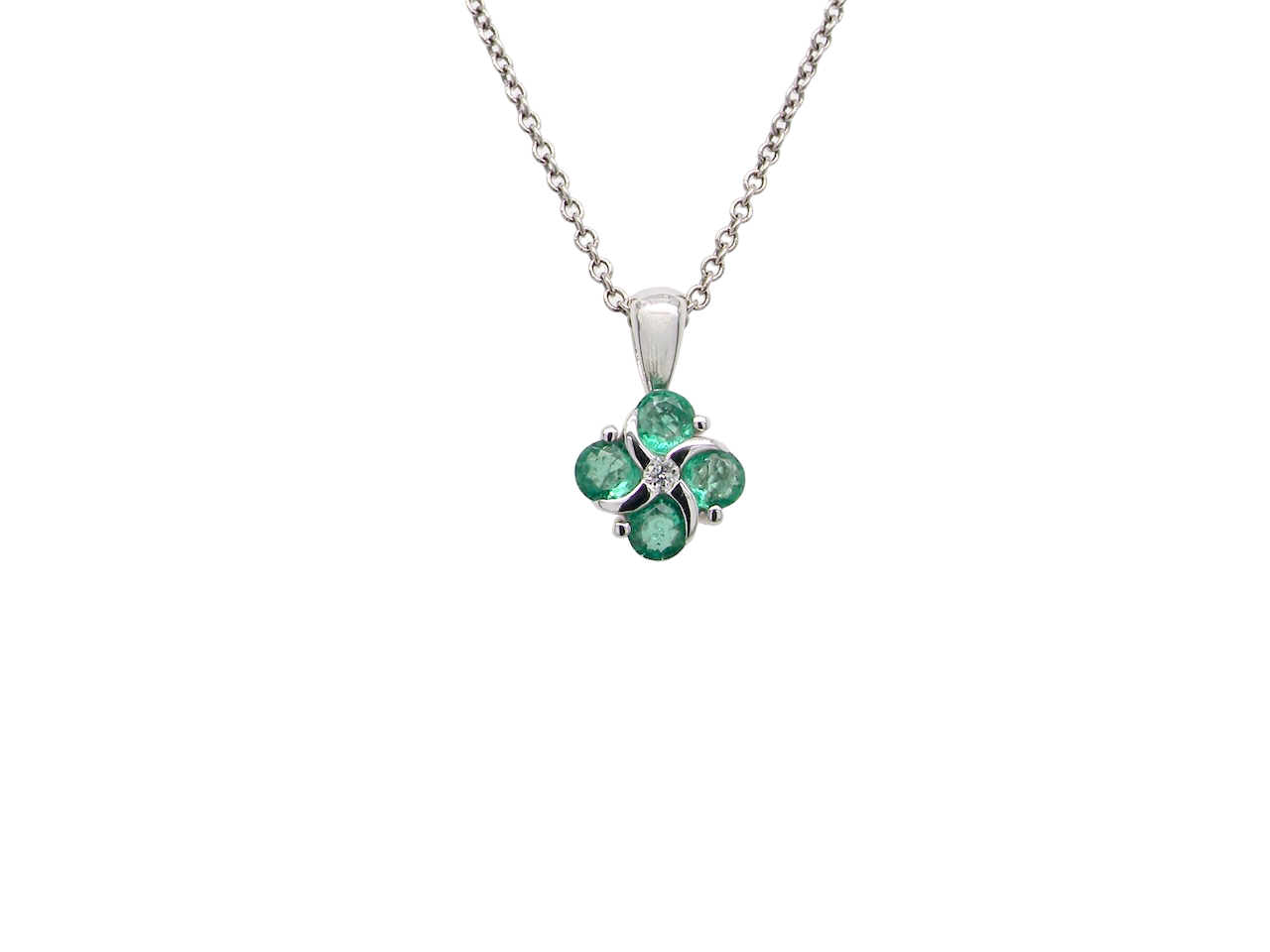 A delicate&nbsp; pendant crafted in 18ct white gold, featuring a cluster of four round emeralds, 
