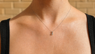 A diamond pendant on a female neck